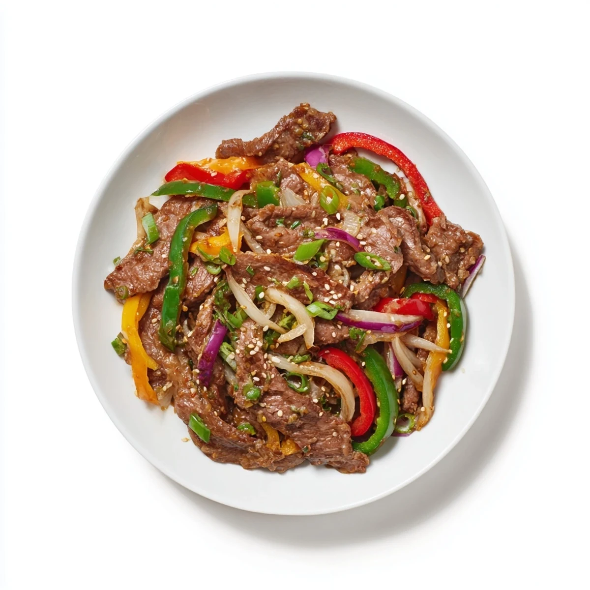 A delicious close-up of Spicy Beef and Pepper Stir Fry showcases glossy sauce and colorful vegetables.