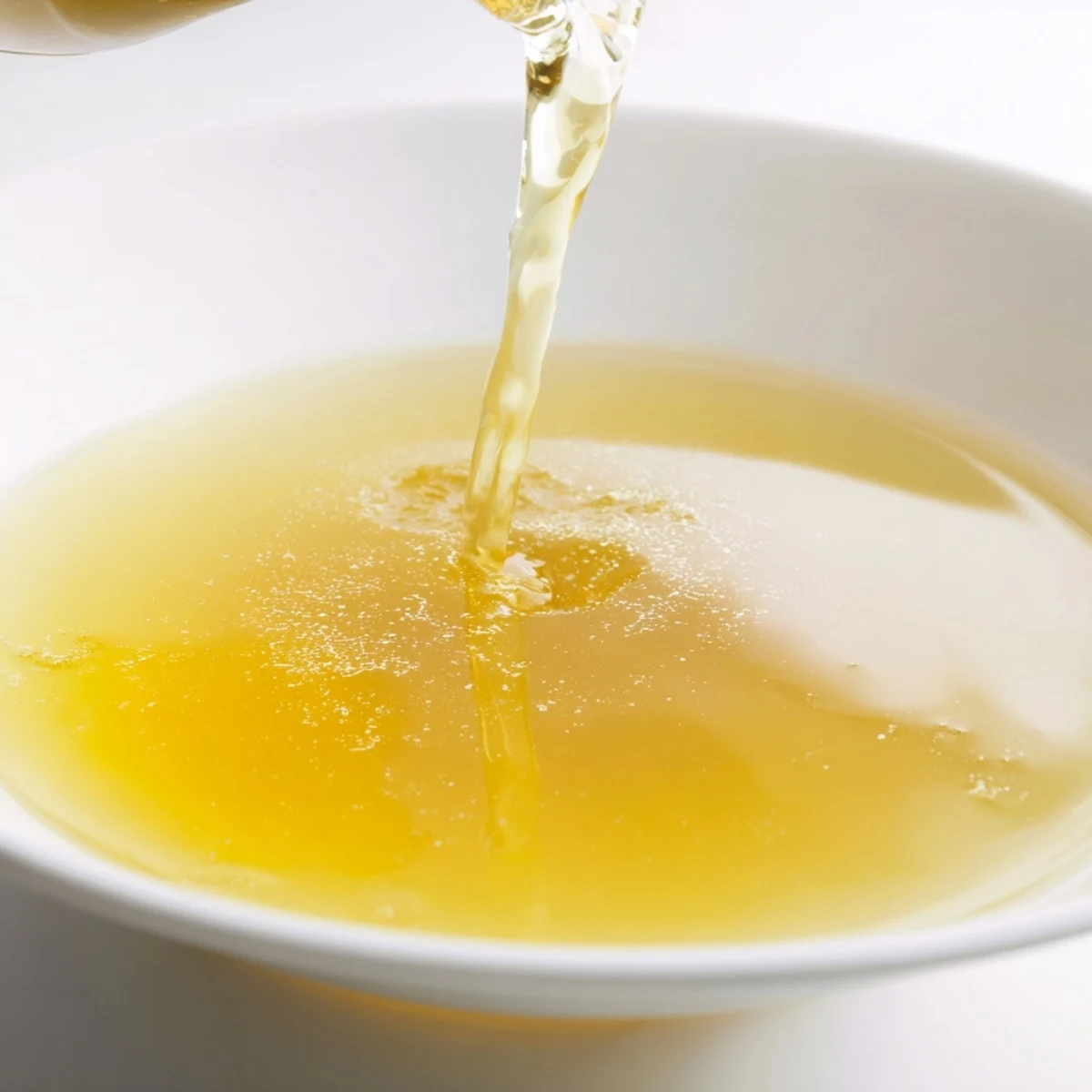 A simmering pot of flavorful Beef Stock, ready to create delicious soups and stews.