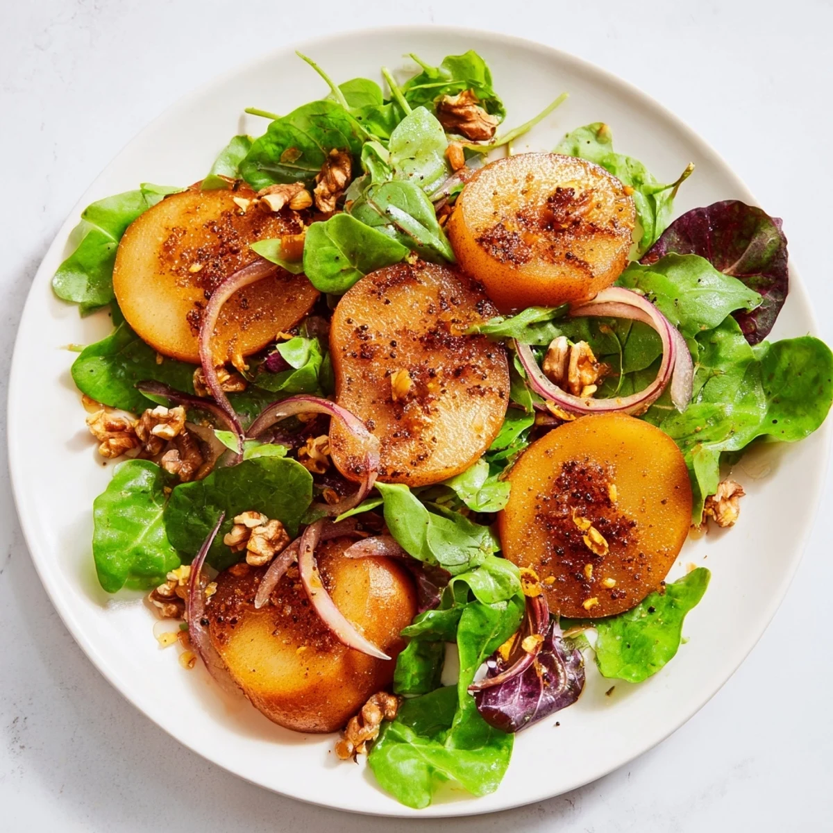 Vibrant Spiced Pear and Walnut Salad, tossed with a honey-mustard dressing and toasted walnuts.