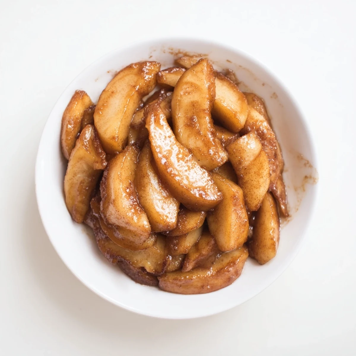 Warm, cinnamon-spiced Baked Apple Slices, tender and glistening, a comforting American dessert.