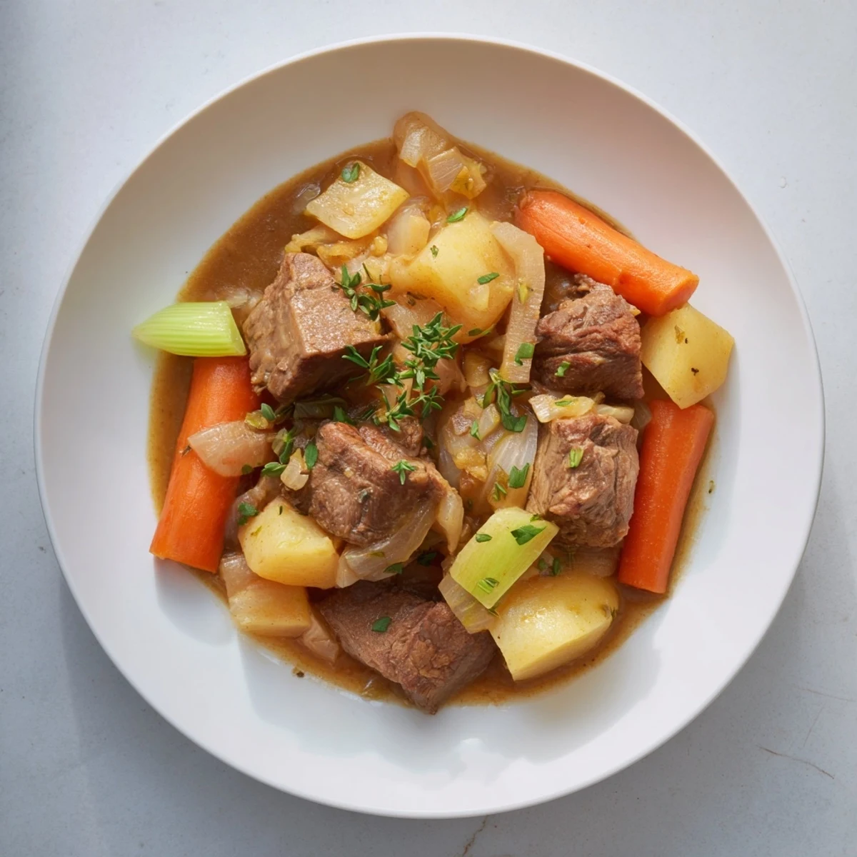 This hearty lamb and potato stew features chunks of lamb, tender potatoes, and vegetables.