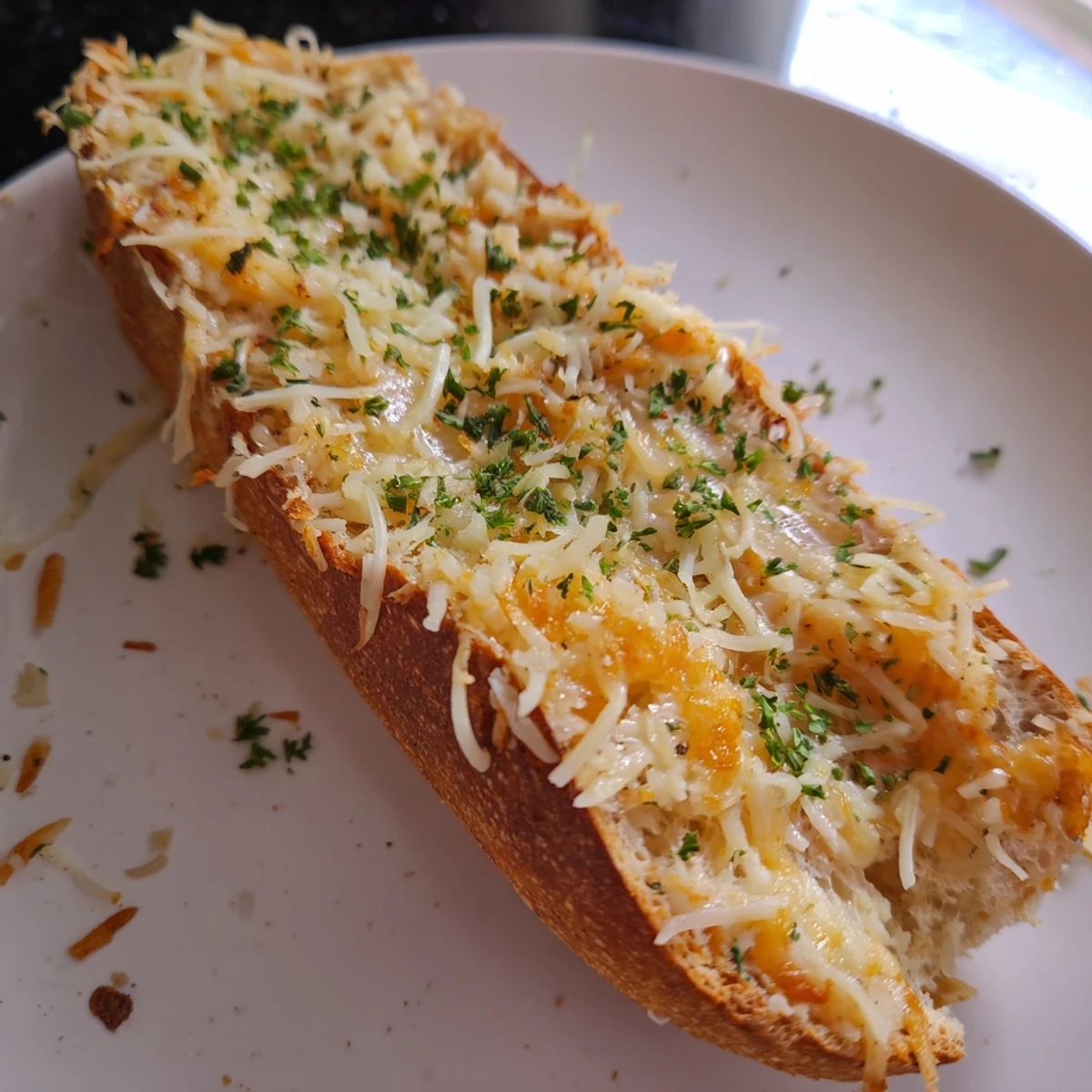 Golden, bubbly Cheesy Bread with melted cheese, perfect for a cozy American appetizer.
