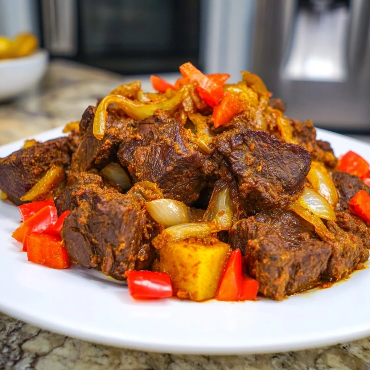 A steaming bowl of Meat Spiced, showcasing slow-cooked, fall-apart tender beef and vegetables.