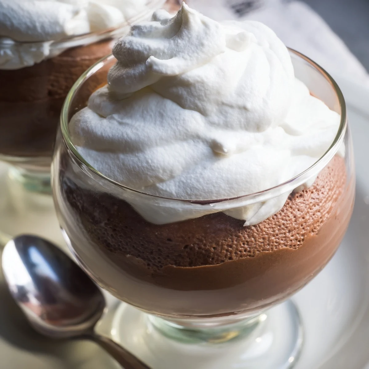 Chilled chocolate mousse layered with velvety whipped cream and rich chocolate shavings.