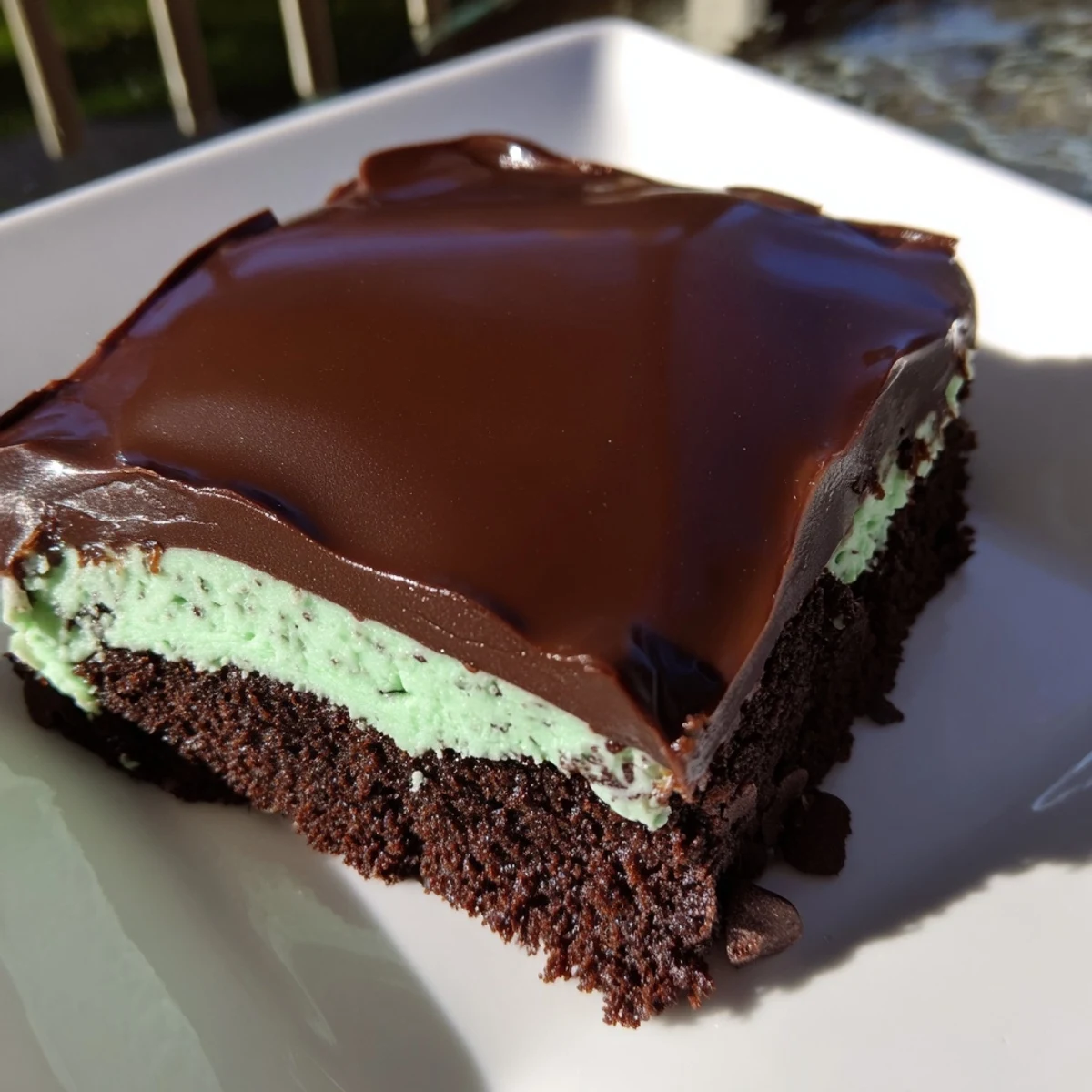 Cool mint and rich ganache layer this classic Mint Chocolate Chip Brownies dessert bar.