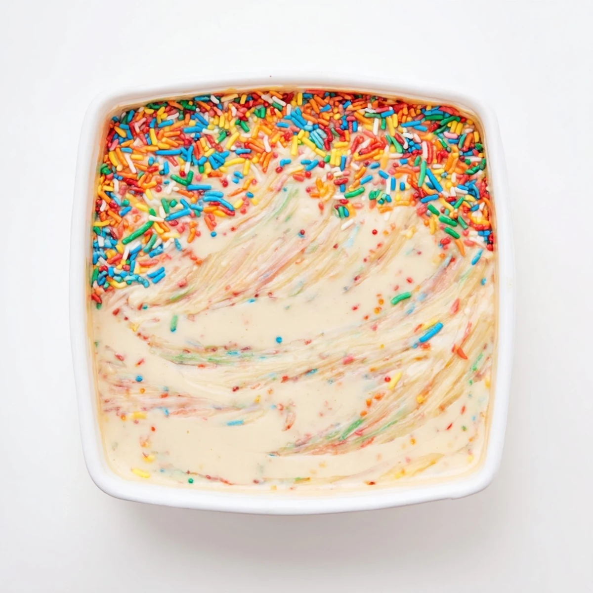 Thick and smooth high protein Dunkaroo dip with vanilla aroma and vibrant rainbow confetti topping