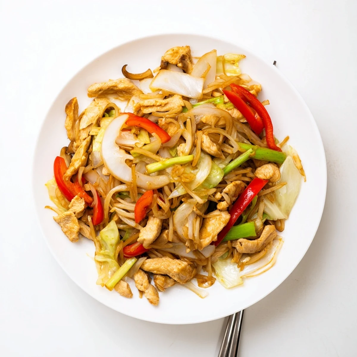 Colorful vegetable Chop Suey stir-fry with tender chicken in glossy savory sauce