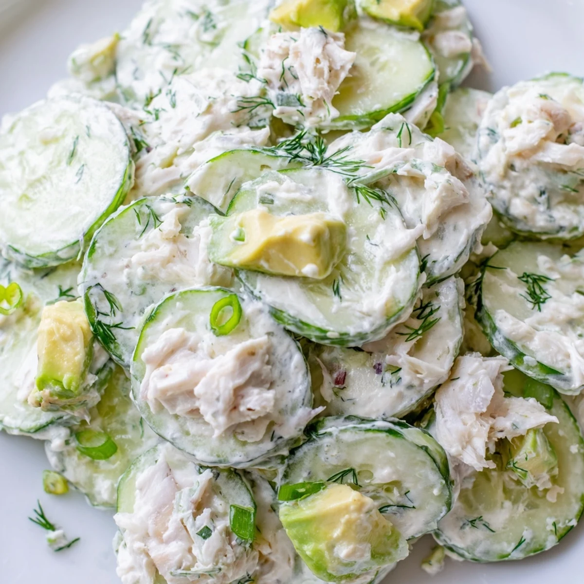 Chilled cucumber salad with crab meat featuring crisp slices and creamy dressing