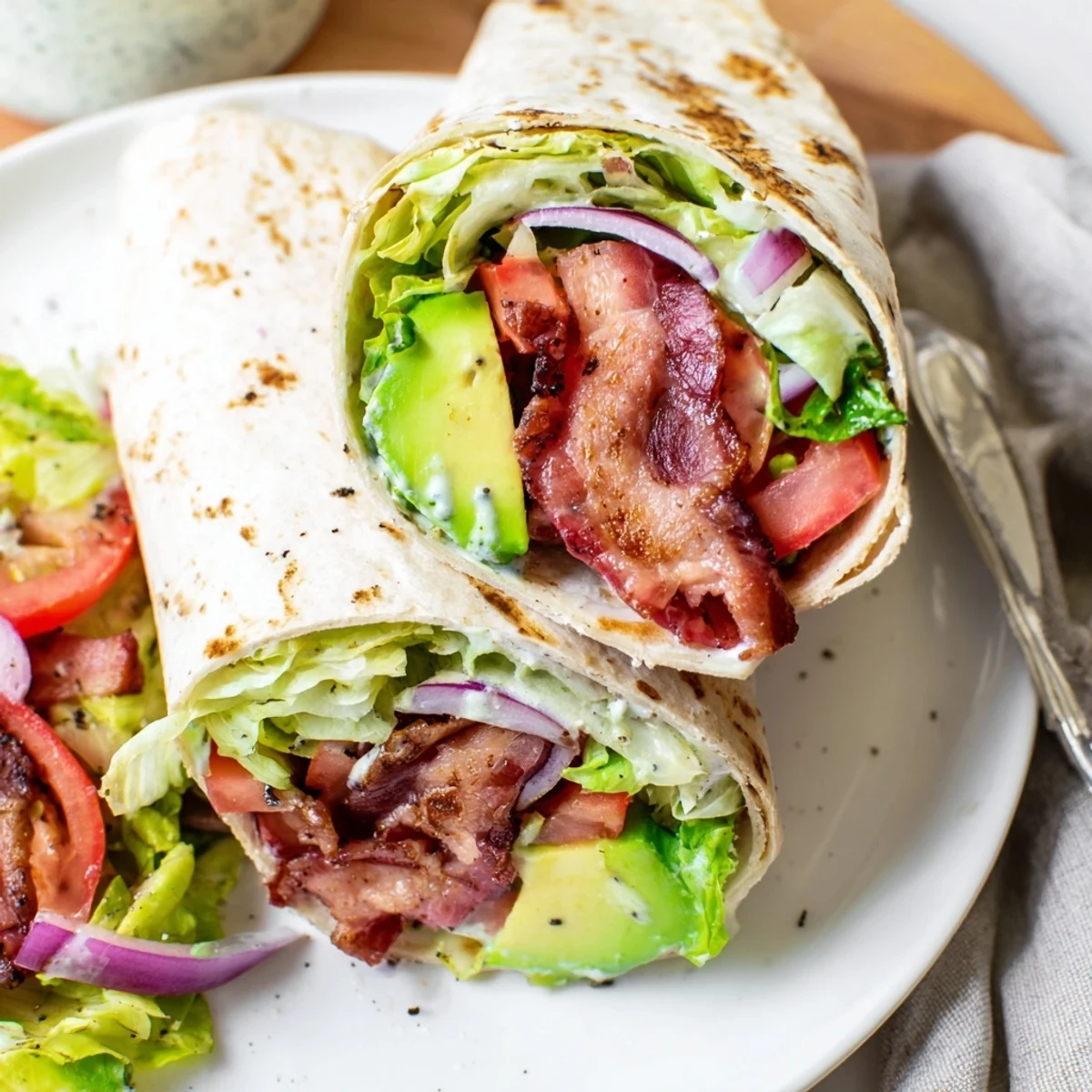 Meal Prep BLT Wraps with crispy bacon, juicy tomatoes, and crunchy romaine