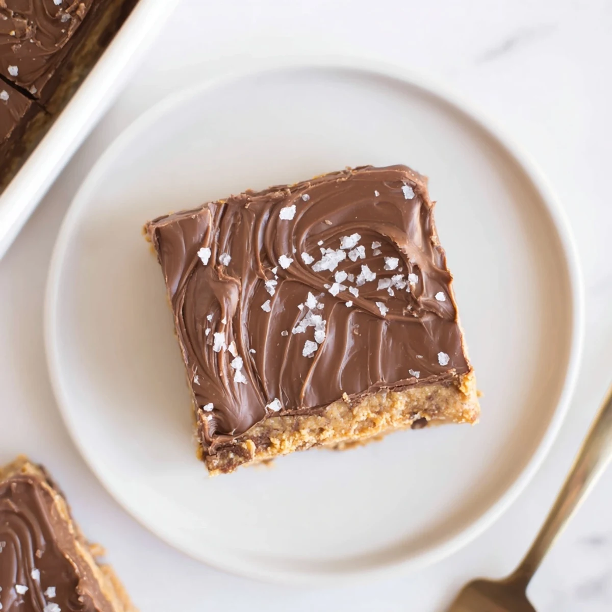 No Bake Peanut Butter Bars with glossy chocolate topping and creamy peanut center