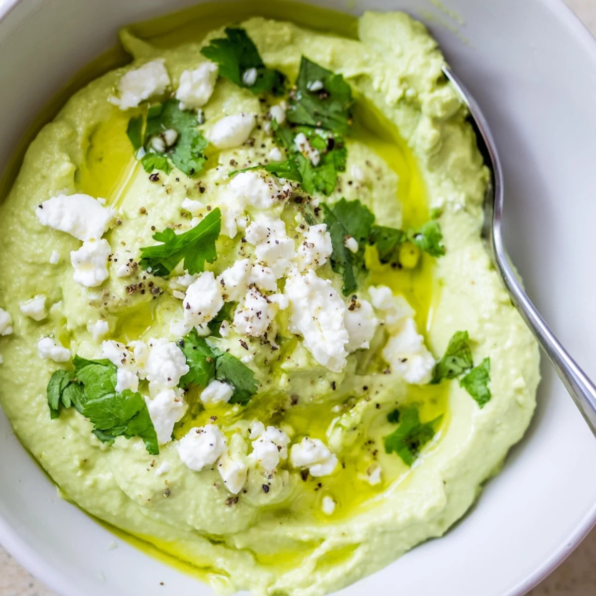 Creamy Avocado Feta Dip, velvety green with lime zest, served with pita