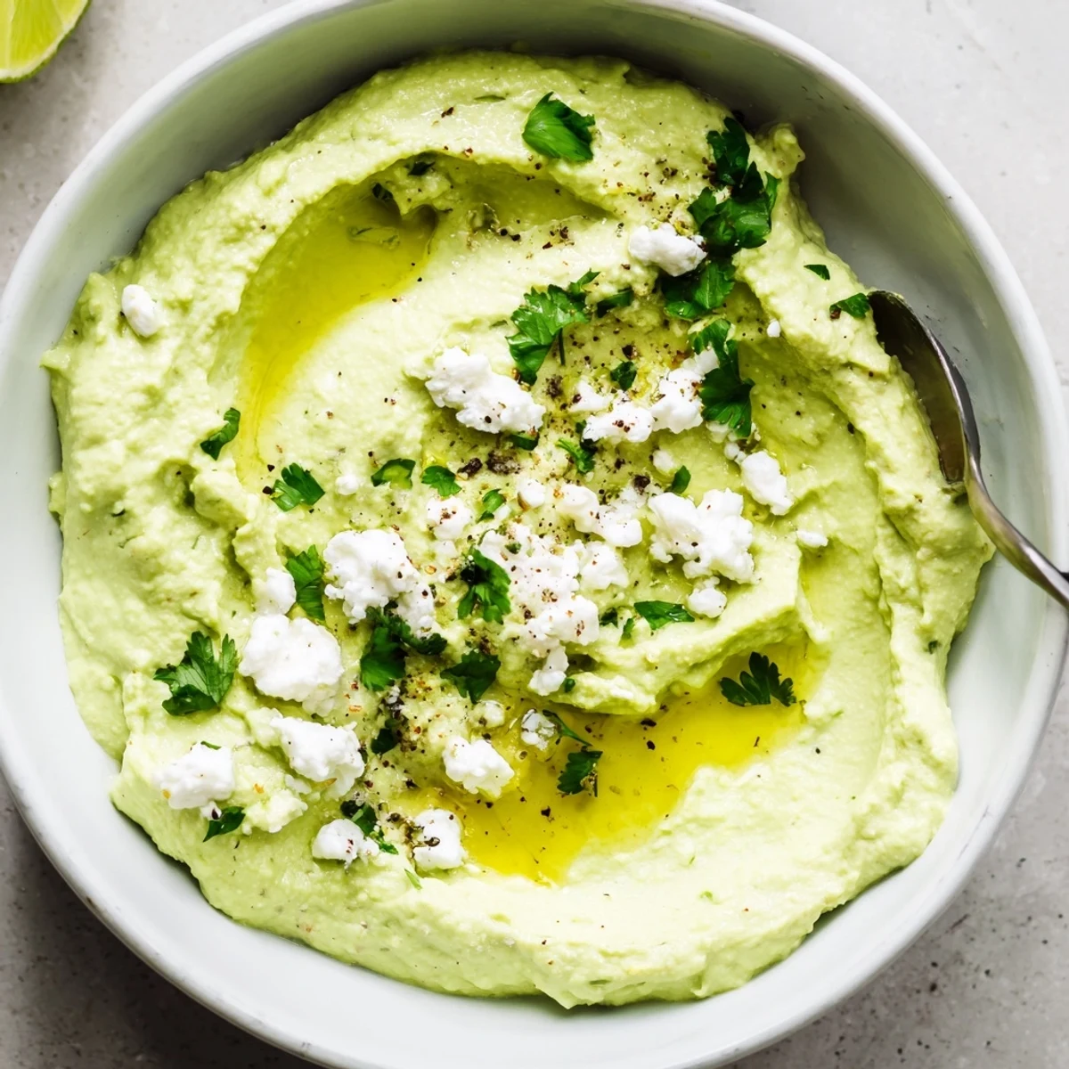 Creamy Avocado Feta Dip spread on toasted bread, garlic and olive aroma