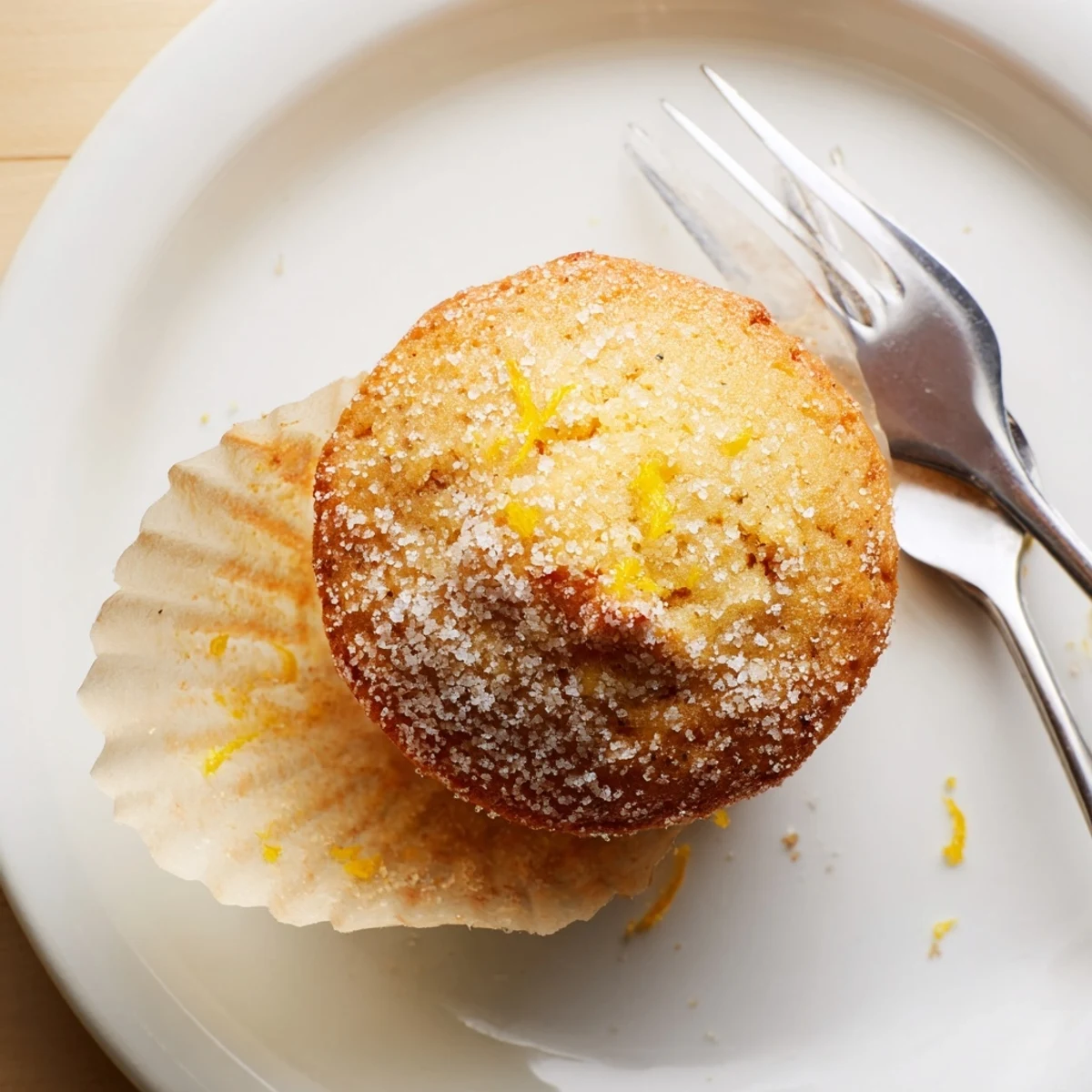 Moist breakfast muffins featuring creamy lemon filling and golden brown crumb tops