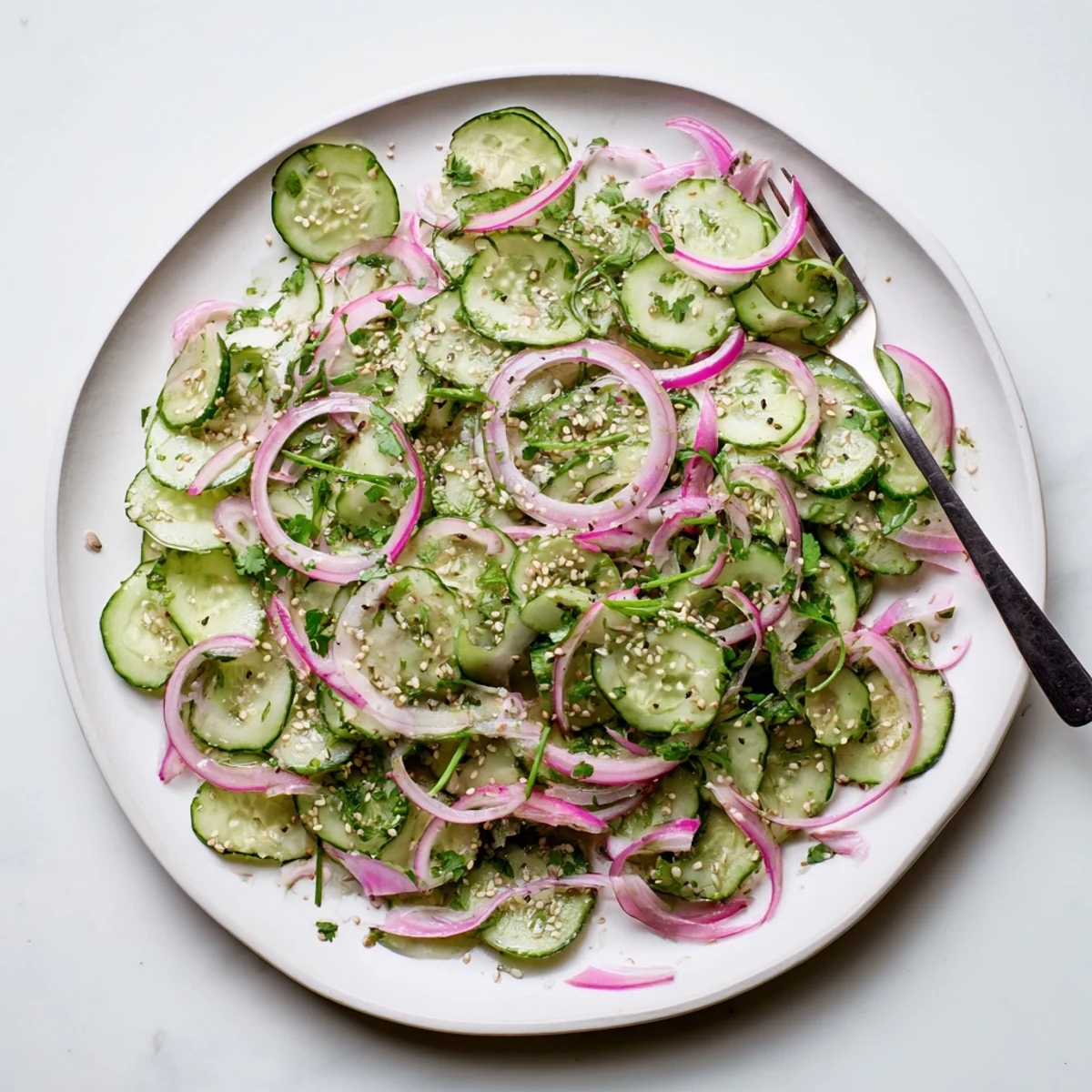 Fresh honey lime cucumber salad featuring crisp cucumber slices in tangy lime-honey dressing with bright green cilantro