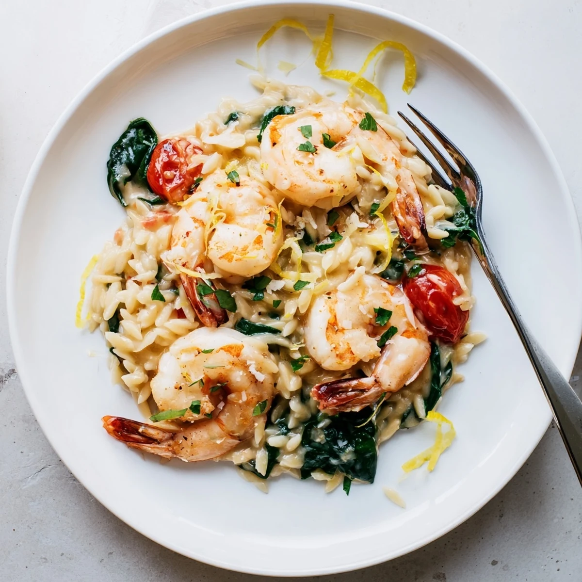 Weeknight Creamy Shrimp Orzo Recipe served hot, spinach wilted, parsley scattered