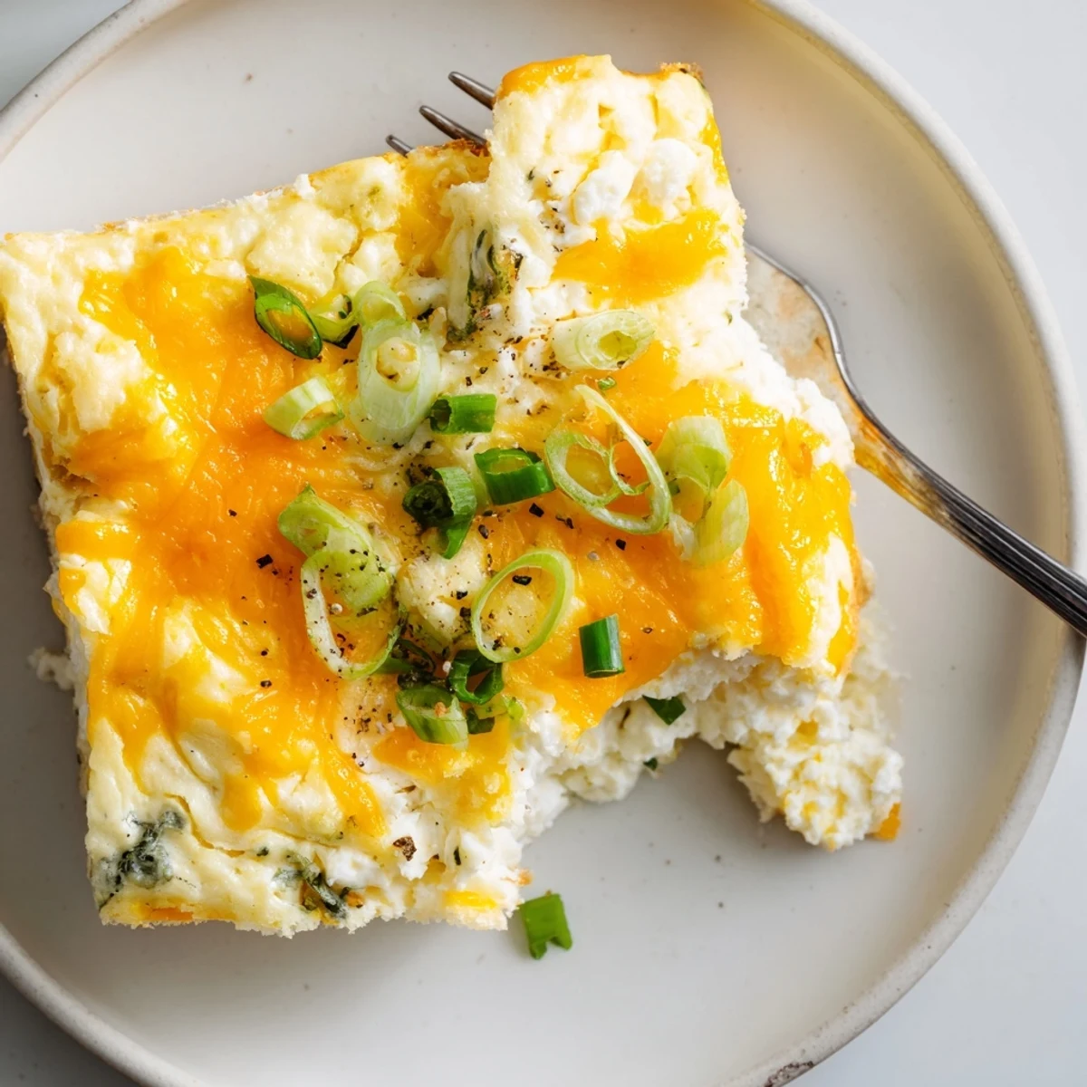 Golden Cheesy Cottage Cheese Eggcloud Bake steaming, fluffy center, melted cheddar topping