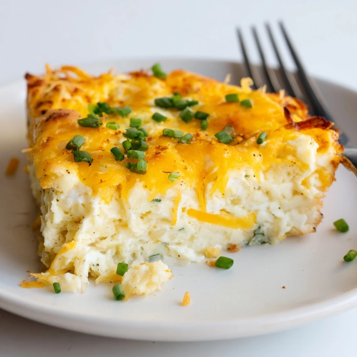 Light, airy Cheesy Cottage Cheese Eggcloud Bake with browned edges, chive garnish