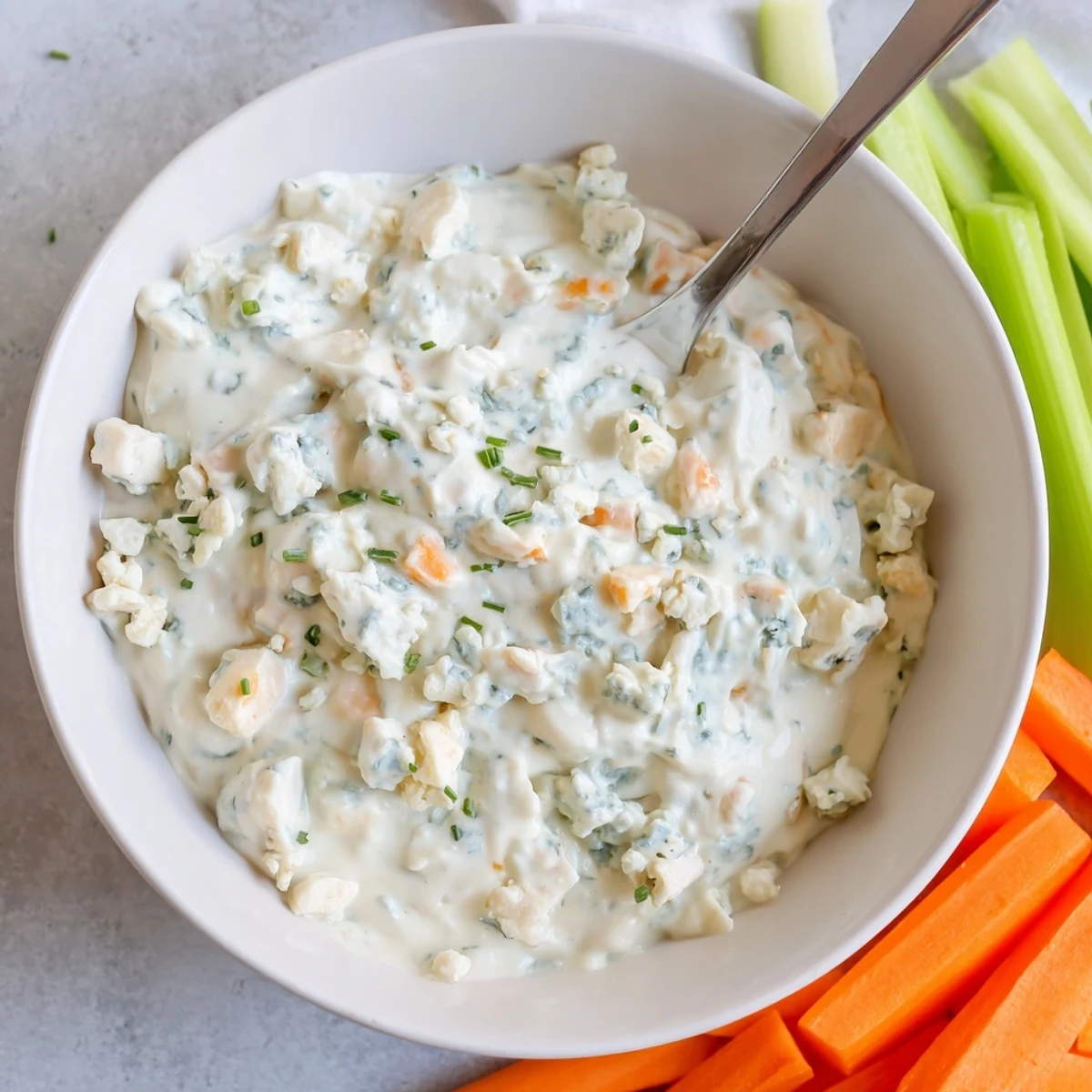 Cool and tangy blue cheese dip paired with crunchy vegetables and toasted crackers
