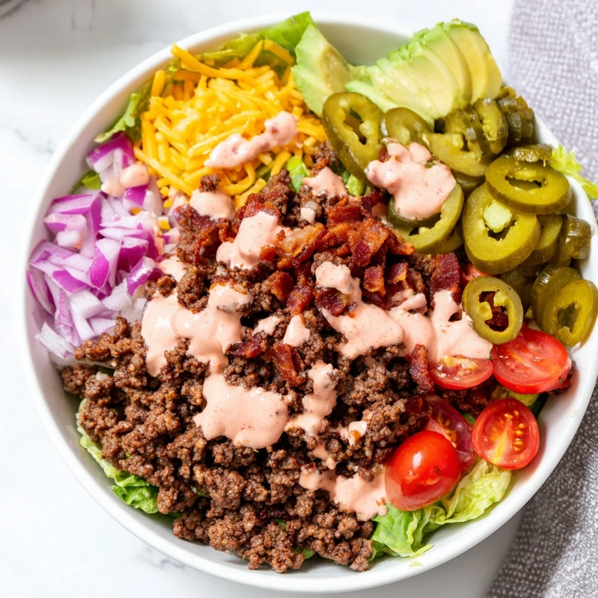 Juicy burger bowls loaded with seasoned beef, melted cheddar, and crisp lettuce